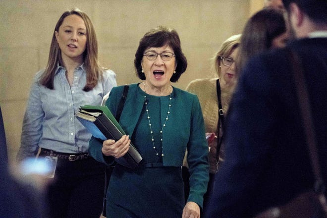 Sen. Susan Collins, R-Maine, center, arrives as Republican senators gather to meet with Senate Majority Leader Mitch McConnell, R-Ky., on the GOP effort to overhaul the tax code, on Capitol Hill, Friday, Dec. 1, 2017, in Washington. [AP Photo/Andrew Harnik]