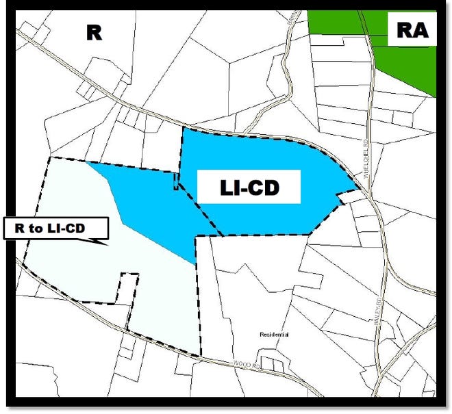 A map shows land requested to be rezoned for use as a solar farm at a Tuesday county commissioner meeting. The blue shaded section was previously approved in 2015, and the white section was approved Tuesday. [Special to The Star]