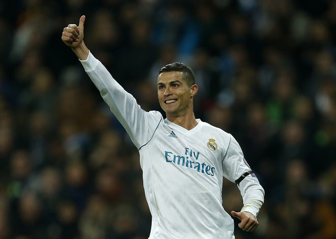 Real Madrid's Cristiano Ronaldo celebrates after he scored during a Champions League match against Borussia Dortmund at the Santiago Bernabeu stadium in Madrid, Spain, on Wednesday. [AP Photo / Paul White]