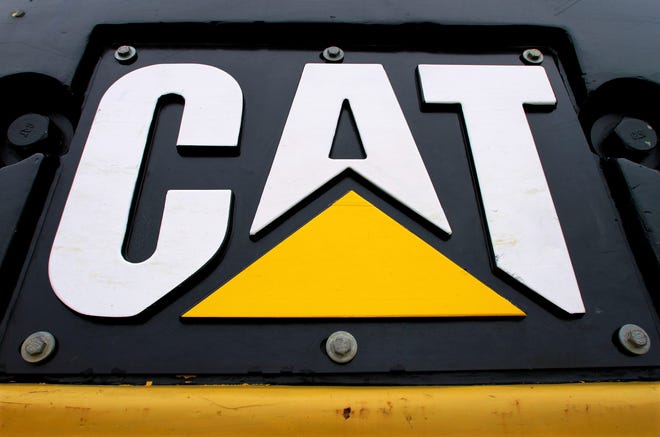 FILE - This April 25, 2011 file photo, shows the Caterpillar company's logo on earth-moving equipment in Springfield, Ill. (AP Photo/Seth Perlman, File)
