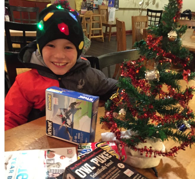 Griffin Nelson, 9, of Exeter hopes to have people donate 250 toys and gifts to the local Toys For Tots drop spot at Tranquility Salon and Spa in downtown Exeter. [Lara Bricker photo]