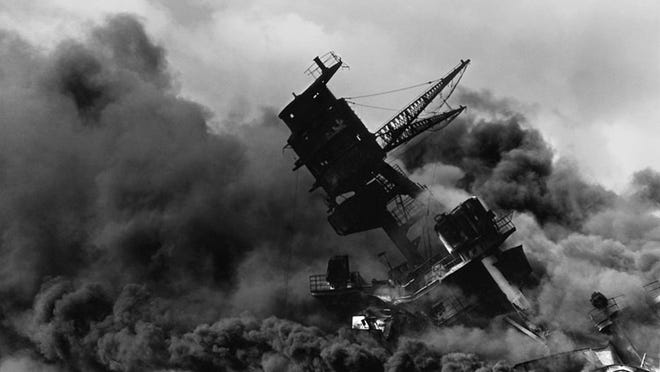 The USS Arizona burning after the Pearl Harbor attack.