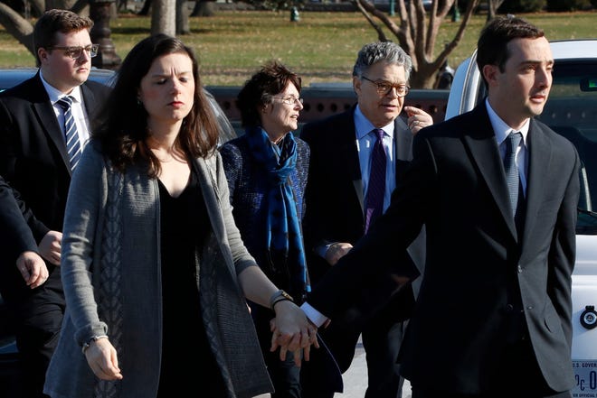 Sen. Al Franken, D-Minn., arrives with his wife Franni Bryson and family to the Capitol on Thursday. (AP Photo/Jacquelyn Martin)