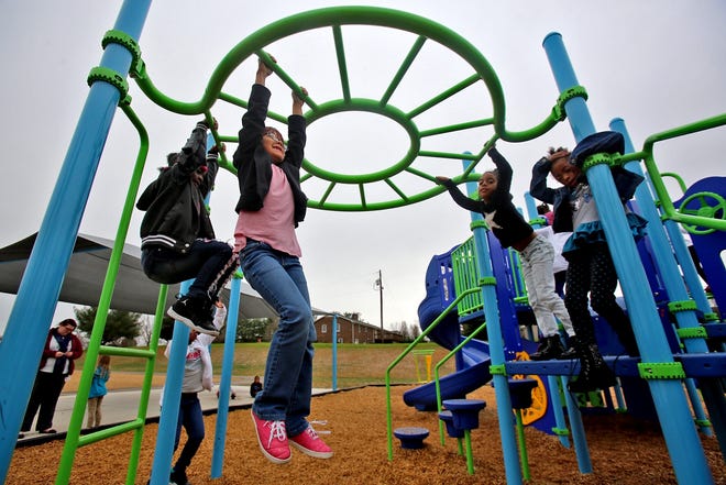 First graders spend Wedneday afternoon playing on the playground at James Love Elementary School. [Brittany Randolph/The Star]