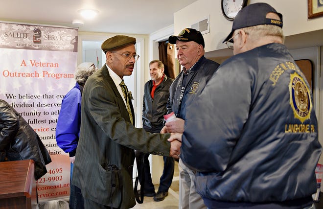 Rodney Wyatt, left, founder and director of Salute 2 Service, welcomes Bob Osterhout and Gene Enama with American Legion Post 148, Langhorne, to the grand opening of the new headquarters for veteran services at 1705-C Bath Road in Bristol Township on Friday. The nonprofit organization aims to provide services for veterans in the Lower Bucks County community. [KIM WEIMER / STAFF PHOTOJOURNALIST]