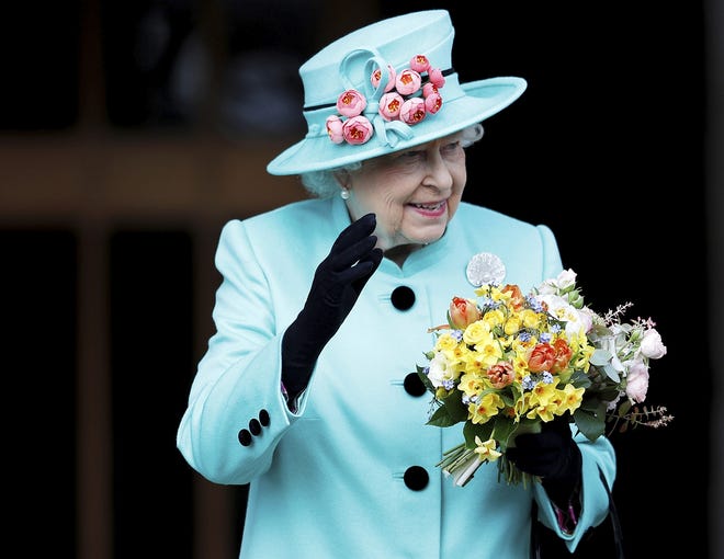 FILE - In this April 16, 2017, file photo, Britain's Queen Elizabeth leaves the Easter Sunday service in Windsor Castle, in Windsor England. The AP reported on Dec. 8, 2017, that a story claiming Queen Elizabeth had remove the Obamas from the guest list for the wedding of Prince Harry and actress Meghan Markle is false. Buckingham Palace has not released a guest list, and the British princeþÄôs office said last month that the exact date for the May wedding hadnþÄôt even been agreed upon. (Peter Nicholls/Pool Photo via AP, File)
