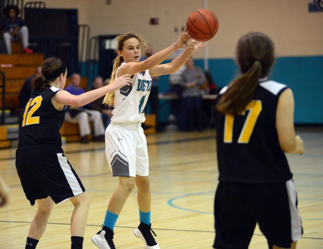 Destin's Samantha Sherer passes the ball outside against the Ruckel Rams. Sherer was high-point player for the Destin Marlins with 17 points in the 42-22 middle school victory Thursday night in Destin. [TINA HARBUCK/THE LOG]