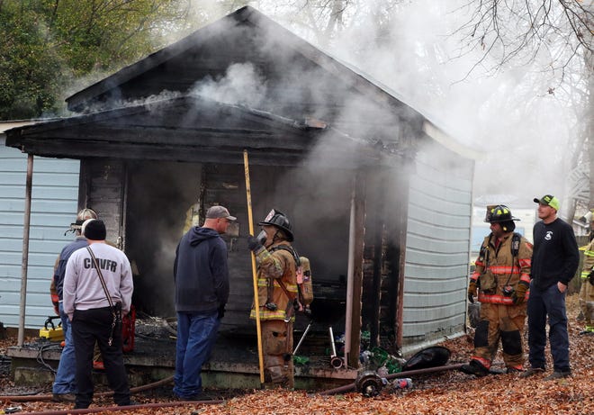 Firefighters work to extinguish a house fire on Maine Avenue in Bessemer City early Friday morning, Dec. 8, 2017. [Mike Hensdill/The Gaston Gazette]