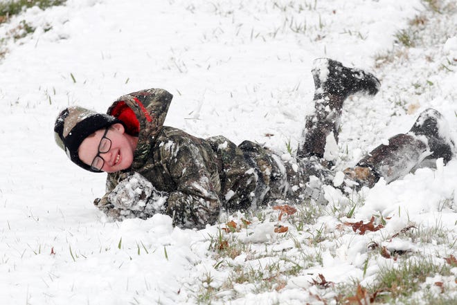 Canon Satcher, 11, rolls in the snow down a hill Friday in Vicksburg, Miss. [Courtland Wells/The Vicksburg Post]