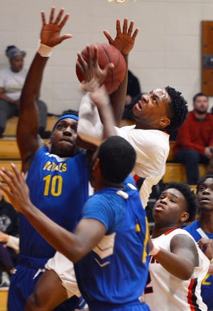 CCC guard Jabari Hibbert puts up a contested shot against Schenectady Saturday at CCC. [ERIC WENSEL/THE LEADER]