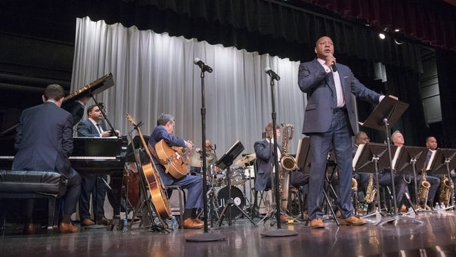 New Orleans trumpeter Wynton Marsalis speaks to an audience of Palm Beach Day Academy students, faculty and guests while standing in front of his band, the Jazz at Lincoln Center Orchestra, Thursday at Palm Beach Day Academy. (Andres Leiva / Daily News)