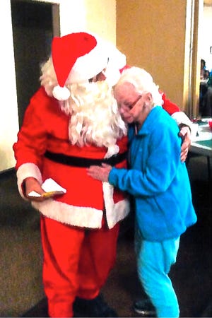 Santa Claus (aka Ken Howe) with Etty Seyler.