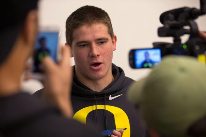 Oregon quarterback Justin Herbert talks to the media after the Oregon Ducks named Mario Cristobal the new head football coach on the campus of the University of Oregon in Eugene, Friday, December 8, 2017. (Brian Davies/The Register-Guard)