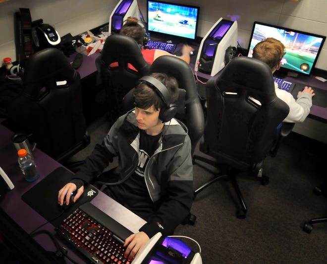 Justin Gray, 18, a player for the Kansas Wesleyan University eSports team, practices with other members of the team. [TOM DORSEY / SALINA JOURNAL]