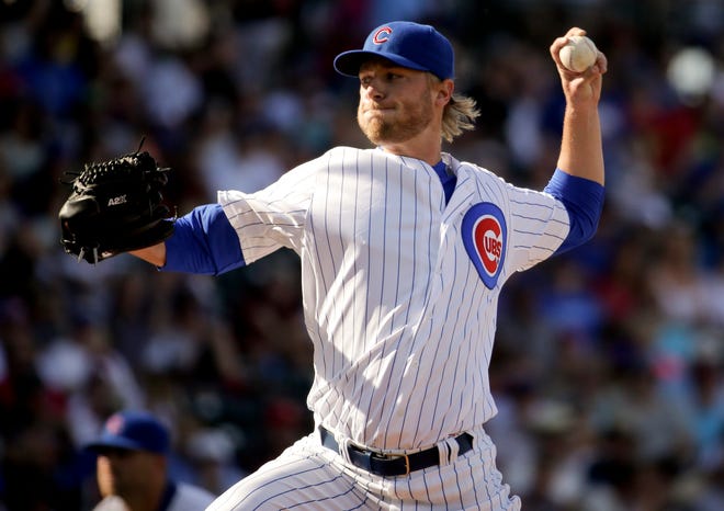 Chicago Cubs starting pitcher Eric Jokisch throws against the Los Angeles Angels during the first inning of a spring training baseball exhibition game in Mesa, Ariz., on Thursday, March 26, 2015. (AP Photo/Chris Carlson)
