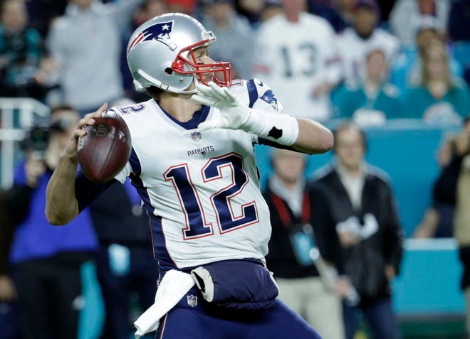 New England Patriots quarterback Tom Brady (12) looks to pass, during the first half of an NFL football game against the Miami Dolphins, Monday, Dec. 11, 2017, in Miami Gardens, Fla. (AP Photo/Lynne Sladky) ORG XMIT: HRS111