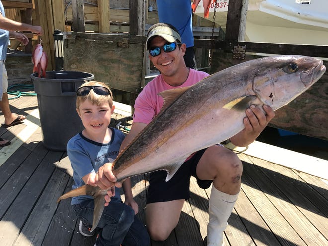 This amberjack was caught aboard the New Florida Girl's American Spirit in March of this year before the season closed in April. [TINA HARBUCK/THE LOG]