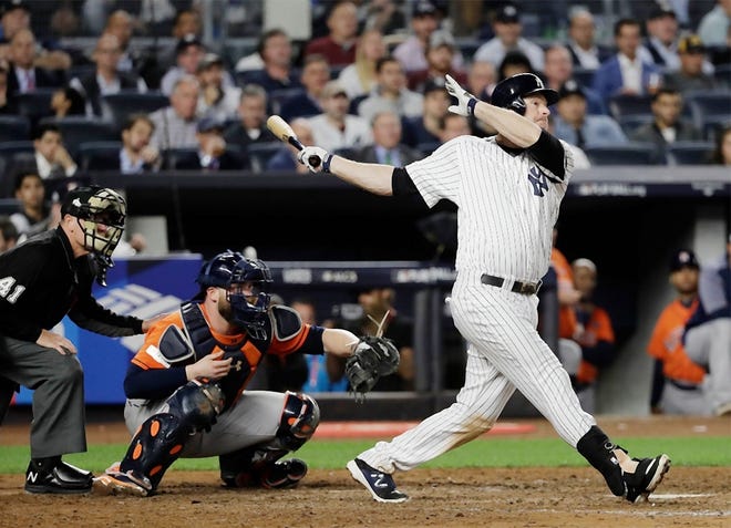 In this Oct. 18 file photo, New York Yankees’ Chase Headley hits a double during the sixth inning of Game 5 of baseball’s American League Championship Series against the Houston Astros in New York. Headley and pitcher Bryan Mitchell have been traded by the Yankees to the San Diego Padres, giving New York added payroll flexibility and room for infield prospects. [DAVID J. PHILIP/ASSOCIATED PRESS]