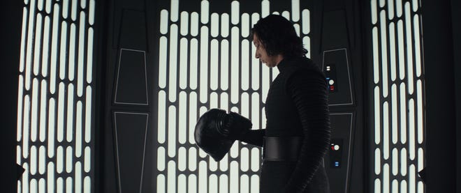 Ever-conflicted Kylo Ren (Adam Driver) wonders if he can be the new Darth Vader. [Walt Disney Studios]