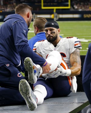 This Oct. 29, 2017, file photo shows Chicago Bears tight end Zach Miller (86) being taken off the field on a cart, after injuring his leg in the second half of an NFL football game against the New Orleans Saints in New Orleans. After eight surgeries and nearly losing his left leg, Miller still refuses to rule out a return to the football field. In his first visit to Halas Hall since his Oct. 29 injury, Miller on Monday, Dec. 11, 2017, expressed thanks for the support he received from the Bears, teammates and fans after vascular surgery to repair a torn artery resulting from a knee injury. (AP Photo/Butch Dill, File)