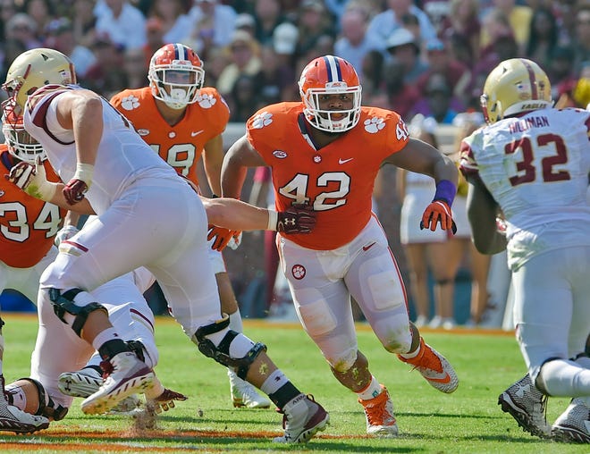 In this Sept. 23, 2017, file photo, Clemson’s Christian Wilkins defends during the first half of an NCAA college football game against Boston College, in Clemson, S.C. Wilkins was selected to the AP All-America team announced Monday, Dec. 11.