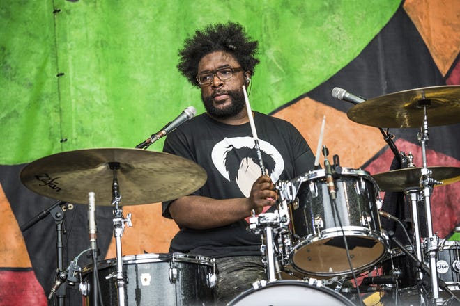 Questlove of The Roots performs in April with Usher at the New Orleans Jazz and Heritage Festival in New Orleans. [Photo by Amy Harris / Invision / AP]