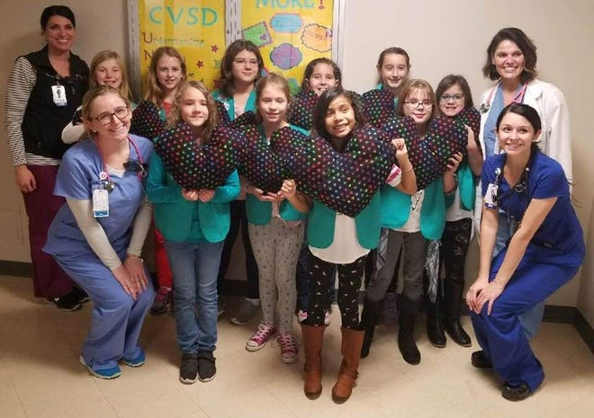 SUBMITTED PHOTOS

Pictured above are members of Swansea Girl Scout Junior Troop 1025 with the pillows they made for the Cardiac Care Unit at Charlton Memorial Hospital and the staff of the unit. The Junior Girl Scouts pictured are, from left to right, Emma Plante, Maddie Coon, Emma Philibert, Josephine Lander, Nadia Albritton, Lana Varao, Kaylee Flores, Emily Boardman, Allison Gendreau and Olivia Bouchard.