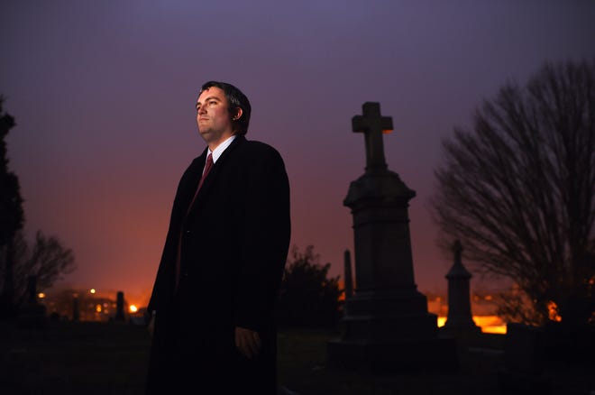 Brett Talley poses for a portrait at Washington's Holy Rood Cemetery in December 2014. [Washington Post photo by Matt McClain]