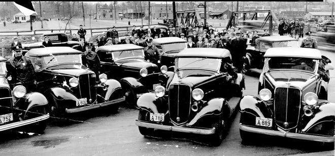 In early December 1933, Providence Police Department patrol cars were equipped with one-way radios. Officers could receive calls from headquarters, but not reply. In this scene near Kinsley Avenue on Christmas Eve 1933, eight Chevrolet convertible patrol cars answered a call for help in less than six minutes. [The Providence Journal, file]