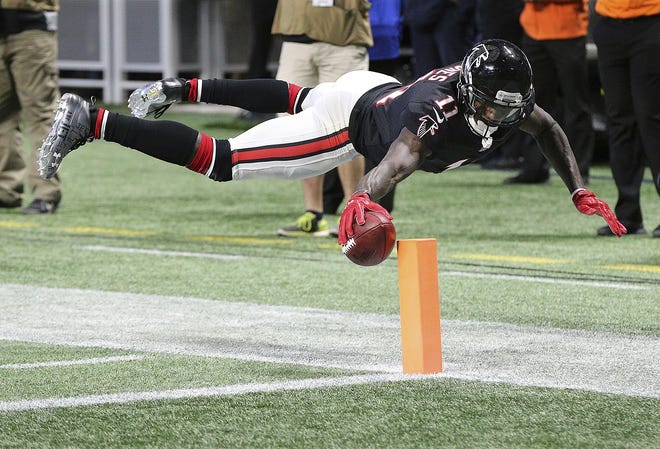 Atlanta Falcons wide receiver Julio Jones reaches over the goal line to score a touchdown against the Tampa Bay Buccaneers on Nov. 26 in Atlanta. Jones had a season-best 12 receptions for 253 yards and two TDs against the Bucs three weeks ago. [Curtis Compton / Atlanta Journal-Constitution via AP, File]