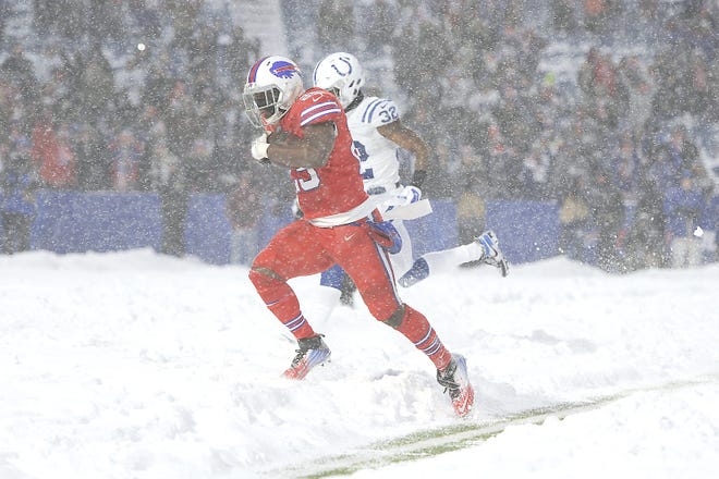 Buffalo Bills running back LeSean McCoy scores the winning touchdown during overtime of Sunday's game against the Indianapolis Colts. [Adrian Kraus / Associated Press]