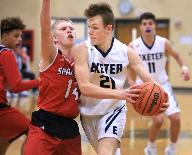 Exeter's Josh Morissette, right, works against Spaulding's Jared Gooley during Friday's Division I boys basketball game. Exeter held on to win, 70-69.

[Ioanna Raptis/Seacoastonline]