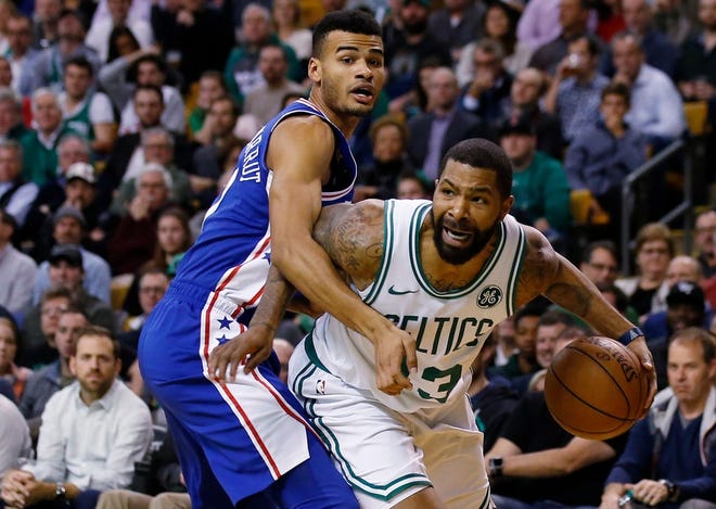 Boston's Marcus Morris, trying to get past Philadelphia's Timothe Luwawu-Cabarrot, during a Nov. 30 game, hopes to get back on the court by Christmas.