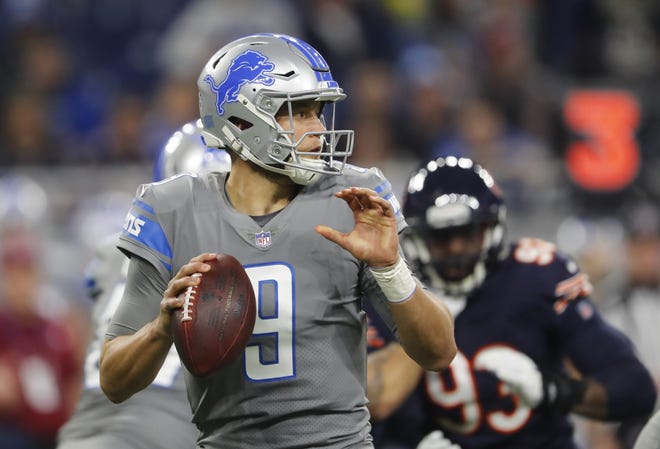 Detroit Lions quarterback Matthew Stafford looks downfield during the first half of an NFL football game against the Chicago Bears, Saturday in Detroit. [PAUL SANCYA / ASSOCIATED PRESS]