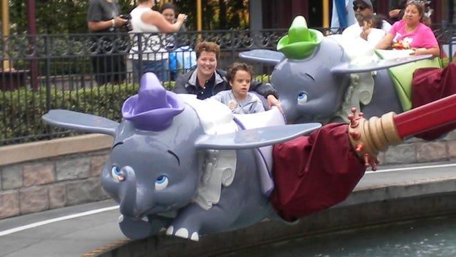 Baxter Wilson-Rul is now 13. He and mom Tiffany Wilson road the Dumbo ride in 2012. Family photo