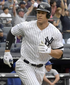 New York Yankees' Aaron Judge rounds the bases after hitting a home run against the Toronto Blue Jays on Sept. 30 in New York. [AP Photo / Bill Kostroun, File]