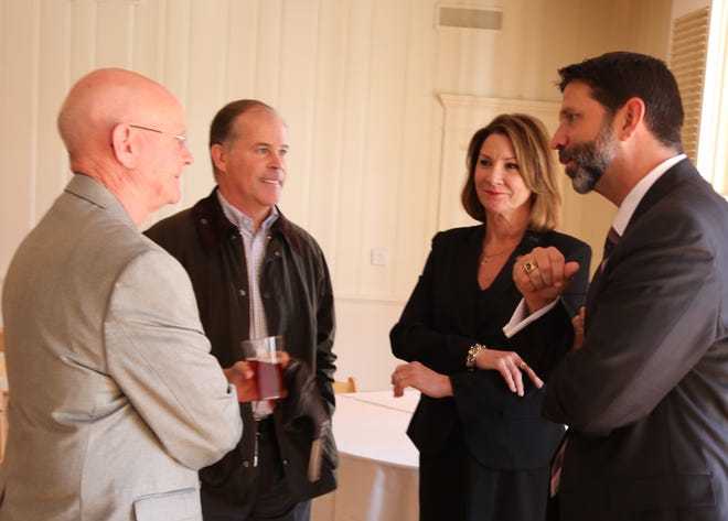 N.C. Rep. Dana Bumgardner, Pharr Yarns President and CEO Bill Carstarphen, N.C. Sen. Kathy Harrington and Gastonia City Manager Michael Peoples discuss South Fork sewer project. [Special to The Gazette]