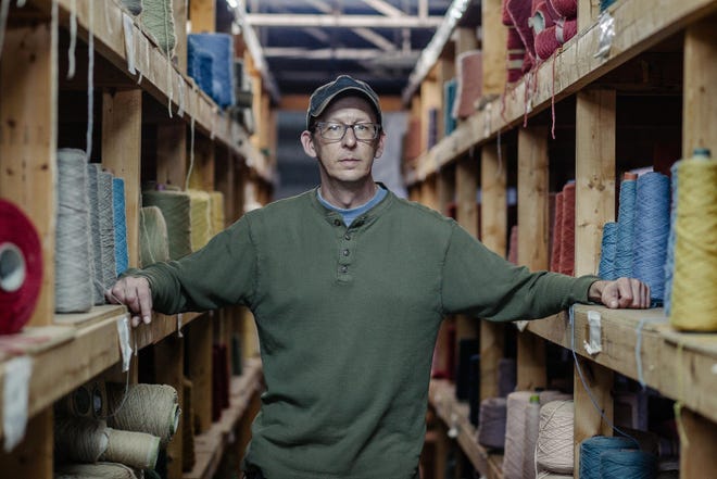 Andy Balla, plant manager at Mountain Heirloom Rugs, inside the production area of the mill, which is now under the ownership of Harry Shelton. [Photo by Jacob Biba/Special to the Times-News]