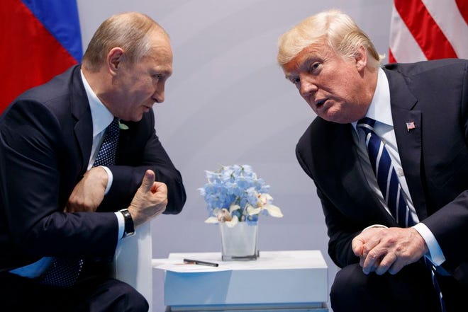 FILE - In this Friday, July 7, 2017, file photo U.S. President Donald Trump meets with Russian President Vladimir Putin at the G-20 Summit in Hamburg. (AP Photo/Evan Vucci, File)