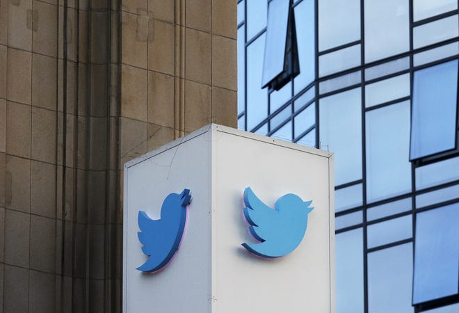 This Wednesday, Oct. 26, 2016, photo shows a Twitter sign outside of the company's headquarters in San Francisco. Twitter will be enforcing stricter policies on violent and abusive content such as hateful images or symbols, including those attached to user profiles, the company announced Monday, Dec. 18, 2017. (AP Photo/Jeff Chiu)