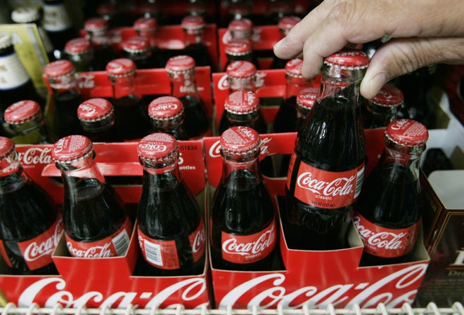Coca-Cola bottles are shown. (AP Photo/Paul Sakuma, file)