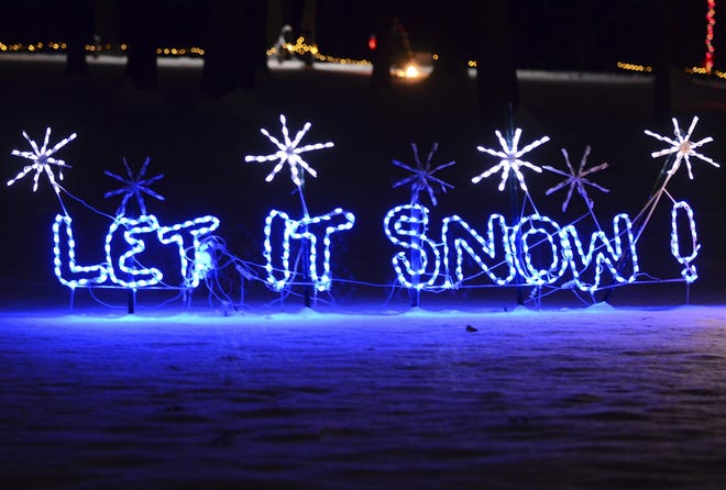 "Let it snow!!" is written in blue lights at the annual Christmas in the Park holiday display in Ewing Park in Ellwood City. [Lucy Schaly/BCT staff]