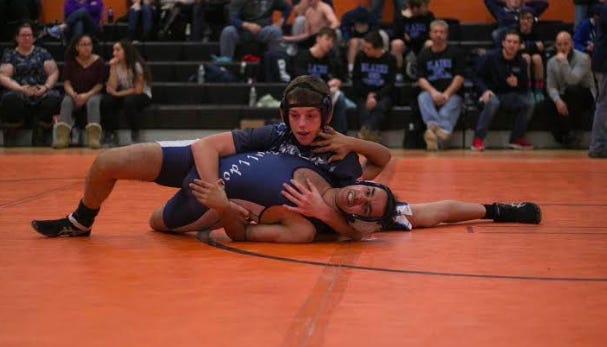 York junior Nat Grader, top, pins his opponent in the 138-pound weight class at Saturday's Tiger Invitational in Gardiner. [Courtesy photo]