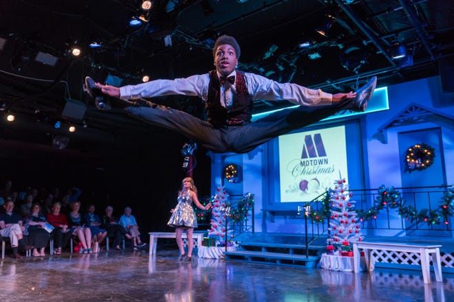 Derric Gobourne Jr. does a split during a dance routine in "A Motown Christmas" at the Westcoast Black Theatre Troupe. [WBTT Photo / Vutti Photography]
