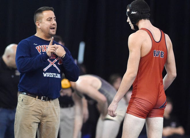 Fort Walton Beach High School coach Tobi Marez talks to one of his wrestlers during the 2016 Beast of the Beach wrestling tournament. Marez is the Daily News Wrestling Coach of the Year. [FILE PHOTO/DAILY NEWS]
