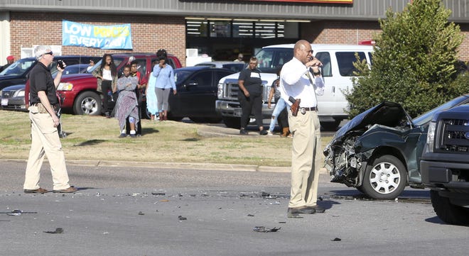Tuscaloosa Police and other law enforcement agencies work the scene of an accident that ended a pursuit at the intersection of Stillman Boulevard and Martin Luther King Boulevard in Tuscaloosa on Wednesday afternoon. [Staff Photo/Erin Nelson]