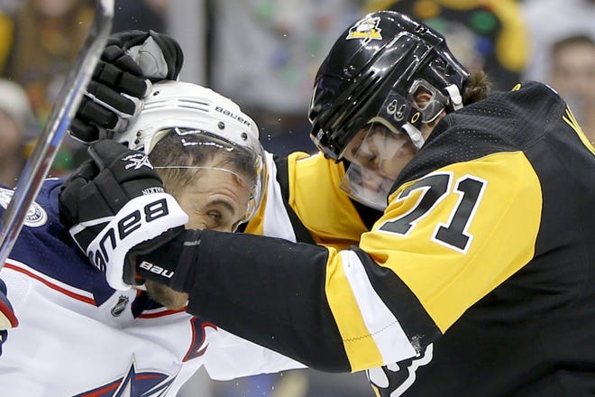 Pittsburgh Penguins' Evgeni Malkin (71) and Nick Foligno, left, fight during the second period of an NHL hockey game Thursday, Dec. 21, 2017, in Pittsburgh. (AP Photo/Keith Srakocic)