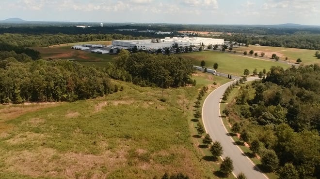 Dhollandia MFG, LLC plans to build its first U.S. manufacturing plant to the left of the Dole Fresh Vegetables plant in the South Ridge Business Park in Bessemer City, as seen in this drone footage. [SPECIAL TO THE GAZETTE/CITY OF BESSEMER CITY]