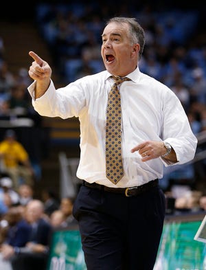 Wofford coach Mike Young gestures during the second half of Wednesday night's game in Chapel Hill, N.C. [Ellen Ozier/The Associated Press]