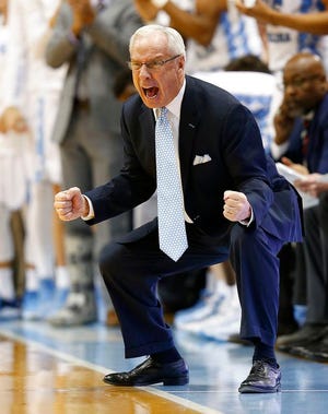 North Carolina coach Roy Willilams tries to rally his team during the second half of an NCAA college basketball game against Wofford in Chapel Hill, N.C., Wednesday. Wofford upset North Carolina, 79-75. (AP Photo/Ellen Ozier)